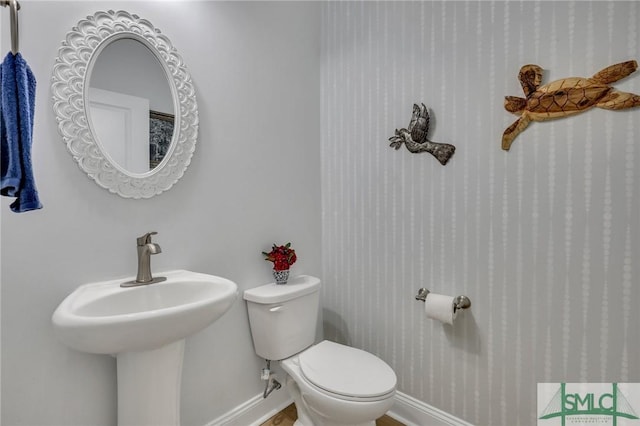 bathroom with sink and toilet