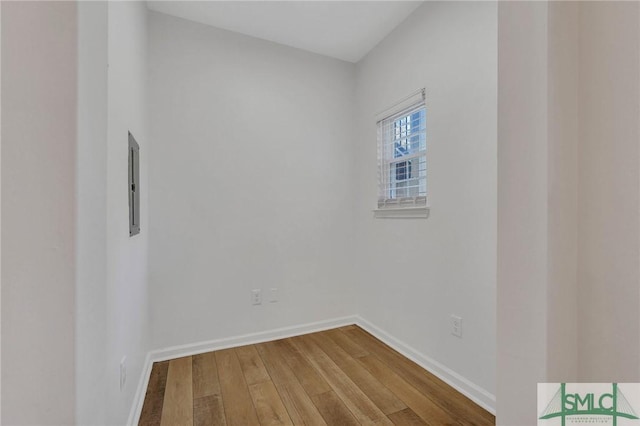 empty room with hardwood / wood-style floors