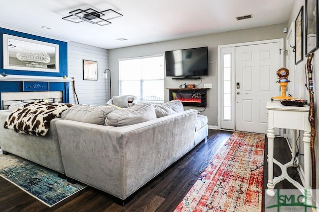 living room featuring dark wood-type flooring