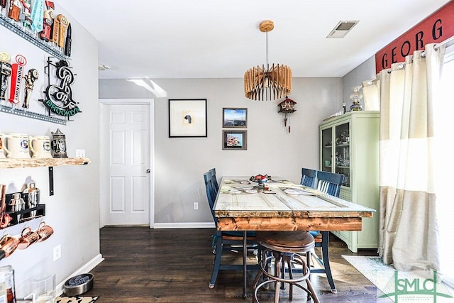 dining space featuring dark hardwood / wood-style floors