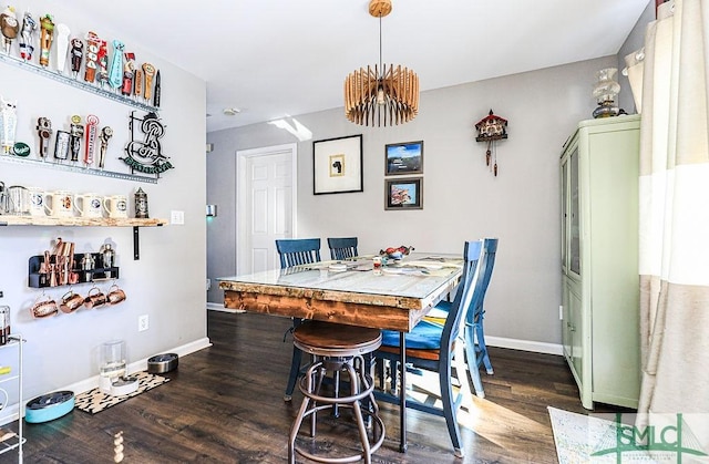 dining space featuring dark hardwood / wood-style floors