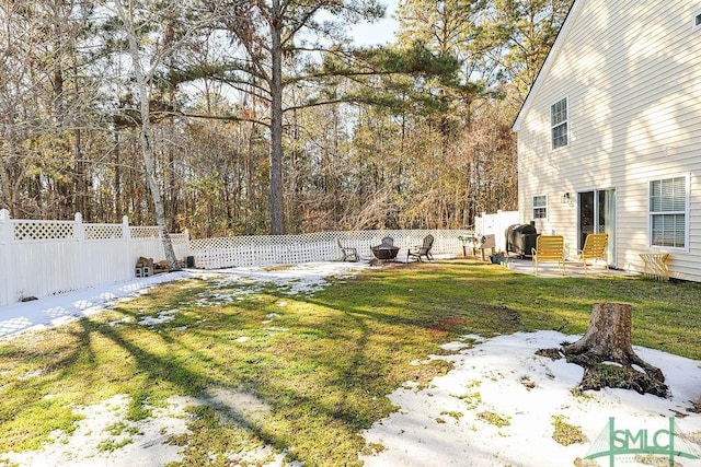 view of yard featuring a patio area and a fire pit