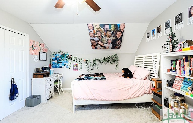 bedroom with ceiling fan, light carpet, and a closet