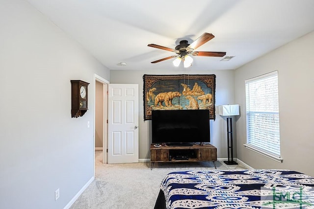 carpeted bedroom with ceiling fan