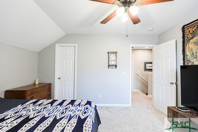 carpeted bedroom featuring vaulted ceiling and ceiling fan