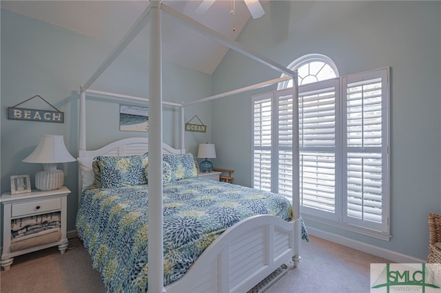 carpeted bedroom with ceiling fan and vaulted ceiling