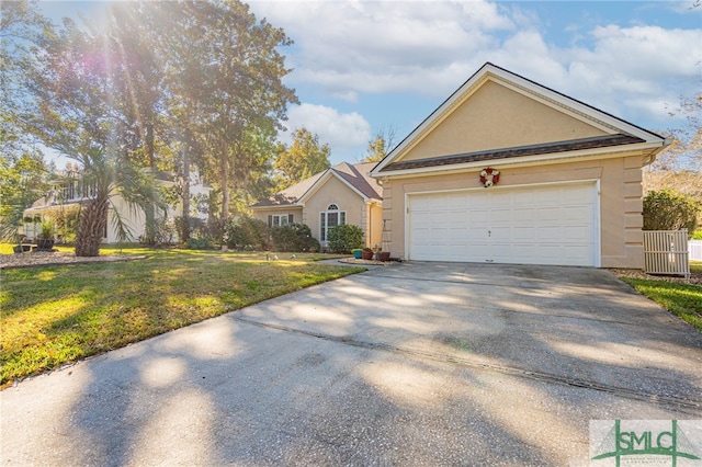 view of front of house with a garage and a front lawn