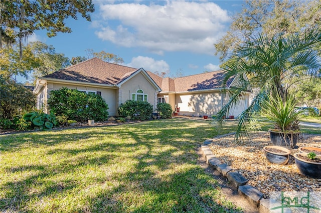 ranch-style house with a front lawn