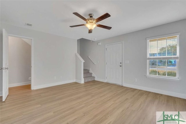 unfurnished room with ceiling fan and light hardwood / wood-style floors