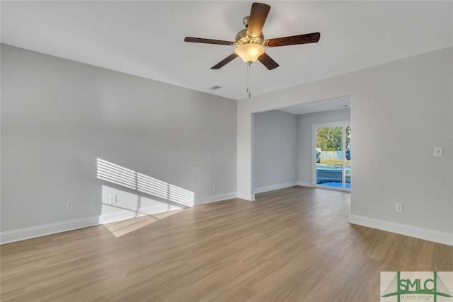 unfurnished room featuring ceiling fan and light hardwood / wood-style floors