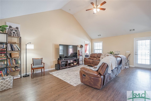 living room featuring ceiling fan, lofted ceiling, and dark hardwood / wood-style floors