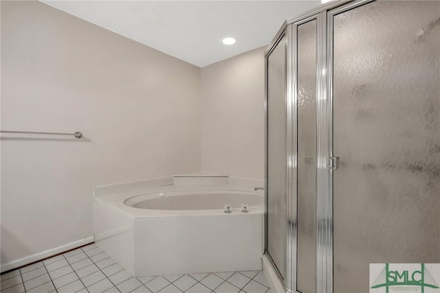 bathroom with tile patterned flooring and separate shower and tub