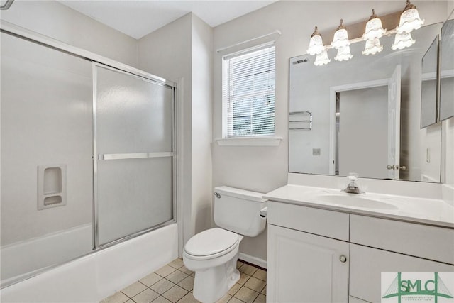 full bathroom with vanity, toilet, tile patterned flooring, and combined bath / shower with glass door