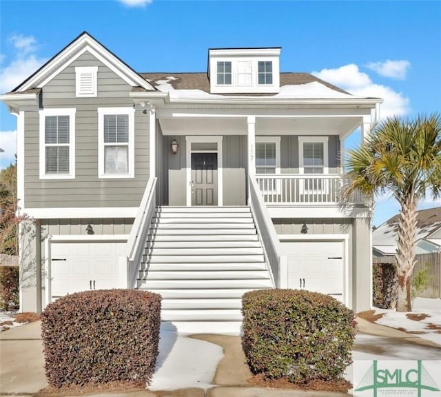 view of front facade featuring a porch and a garage