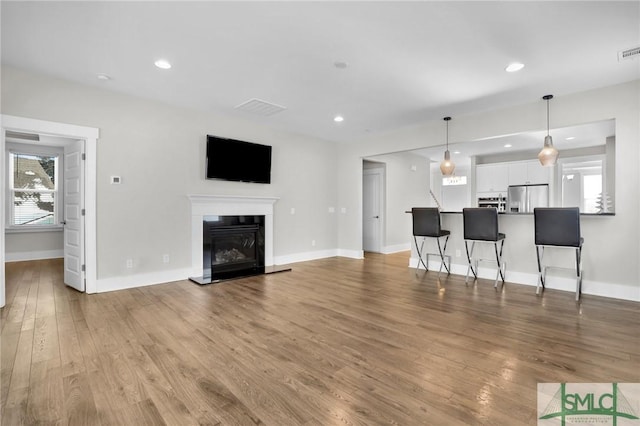 living room with light hardwood / wood-style floors