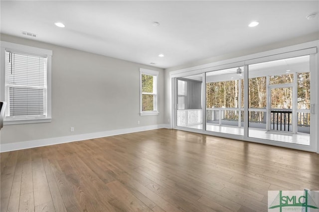 unfurnished room featuring ceiling fan and wood-type flooring