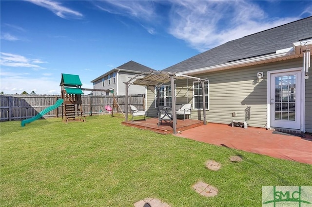 view of yard featuring a playground, a patio, and a pergola