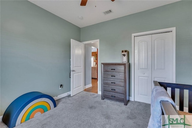 carpeted bedroom with a closet and ceiling fan