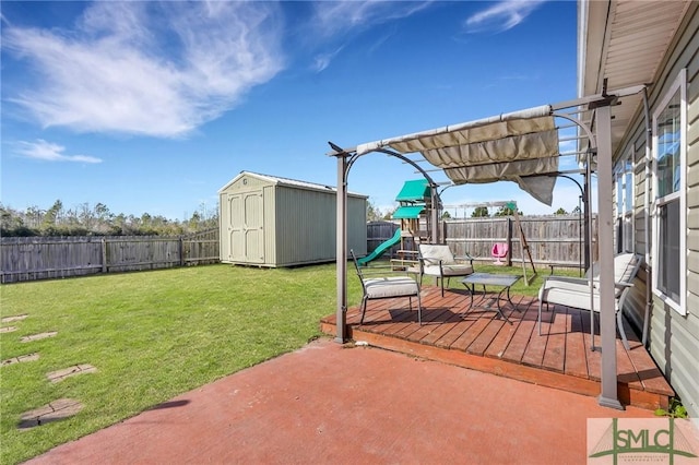 view of patio / terrace featuring a playground and a storage unit