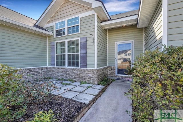 entrance to property with a patio