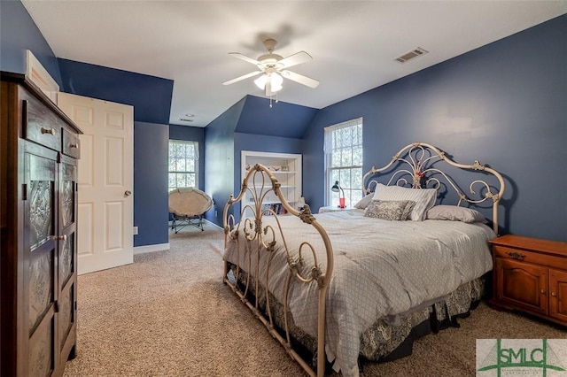 carpeted bedroom with vaulted ceiling and ceiling fan