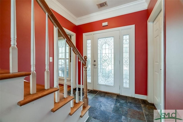 entryway featuring ornamental molding