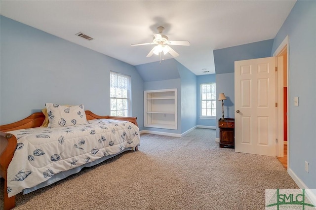 carpeted bedroom featuring lofted ceiling and ceiling fan