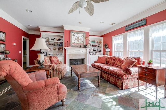 living room with ceiling fan, ornamental molding, and built in features