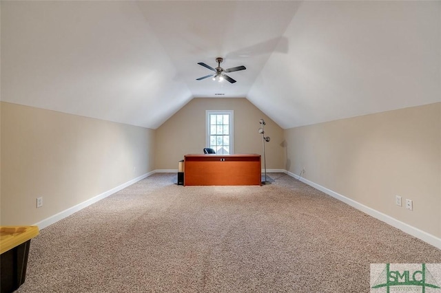 bonus room featuring lofted ceiling, carpet floors, and ceiling fan