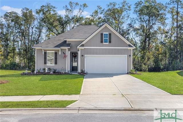 view of front facade with a garage and a front lawn