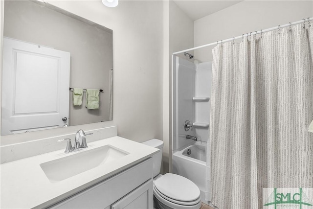 full bathroom with shower / tub combo with curtain, vanity, and toilet