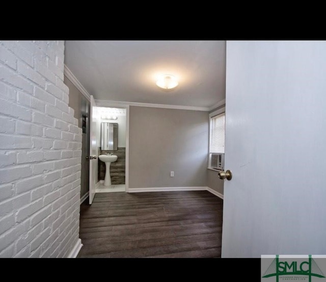 empty room with crown molding, dark hardwood / wood-style floors, and cooling unit