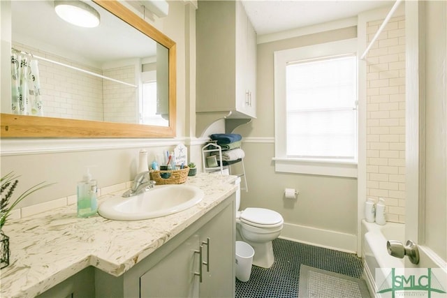 full bathroom featuring shower / tub combo, vanity, toilet, and tile patterned flooring