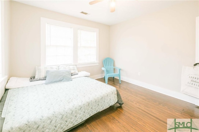 bedroom featuring hardwood / wood-style floors and ceiling fan