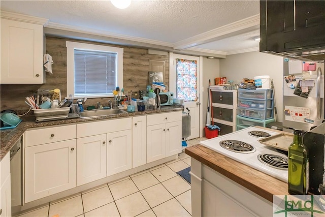 kitchen featuring stainless steel appliances, white cabinetry, sink, and a textured ceiling