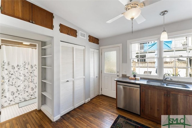 kitchen with sink, stainless steel dishwasher, ceiling fan, dark wood-type flooring, and built in shelves