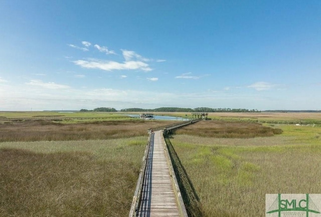 view of yard featuring a water view and a rural view