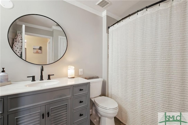 full bathroom featuring toilet, ornamental molding, vanity, and visible vents