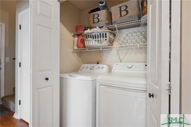 clothes washing area featuring washer and dryer and laundry area