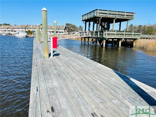 view of dock with a water view