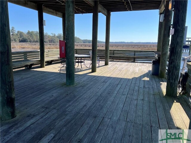 wooden terrace featuring a rural view