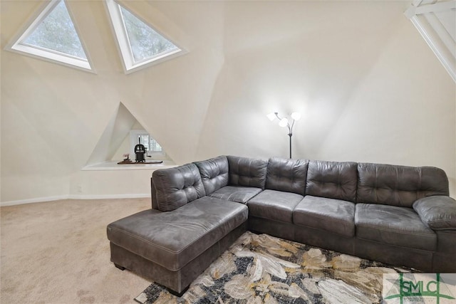 living room featuring a towering ceiling and light colored carpet