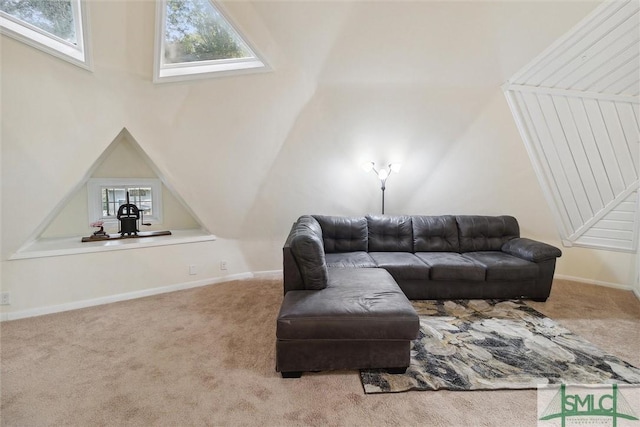 living room with lofted ceiling and carpet floors