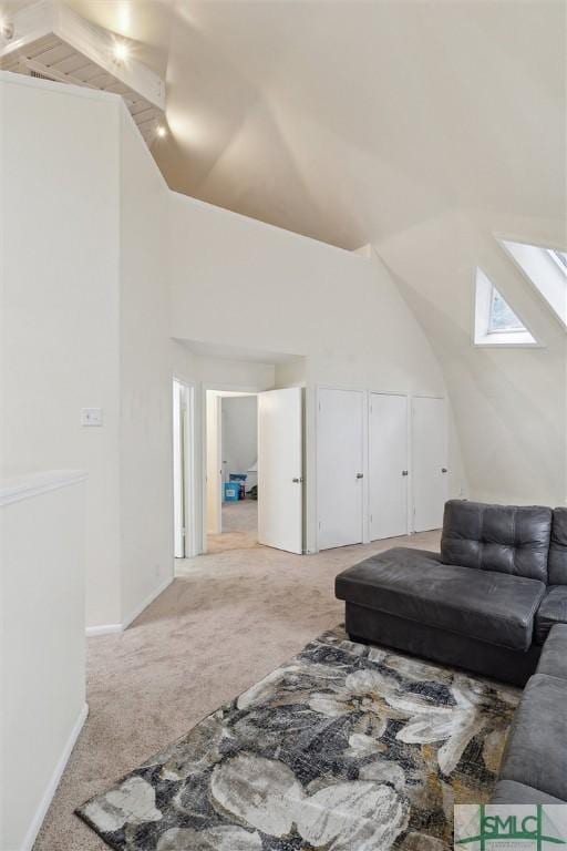 carpeted living room featuring lofted ceiling