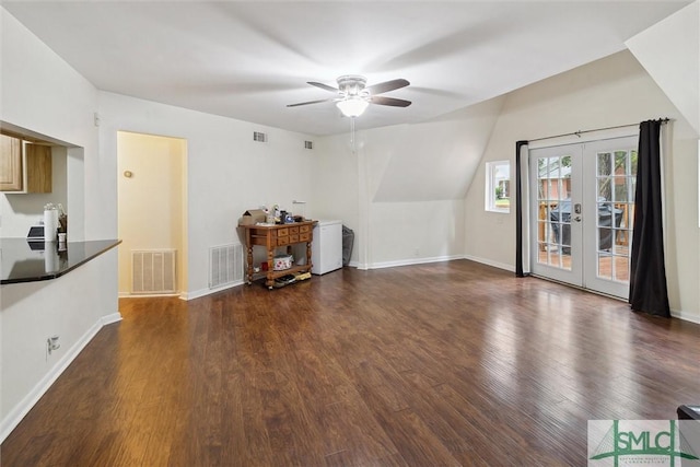 living room featuring french doors, ceiling fan, dark hardwood / wood-style flooring, and vaulted ceiling