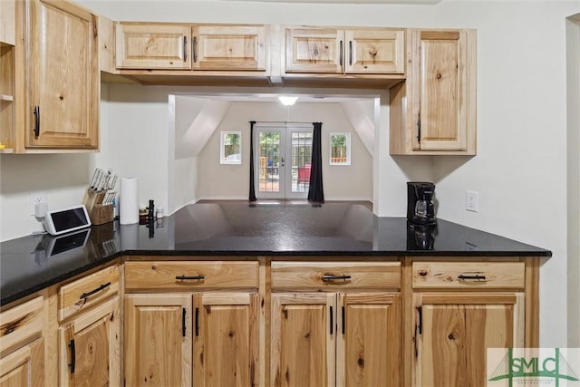 kitchen featuring light brown cabinetry and french doors