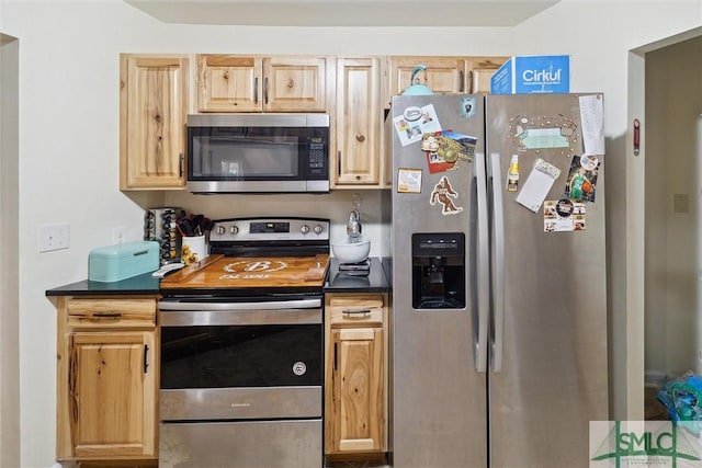 kitchen with stainless steel appliances and light brown cabinets