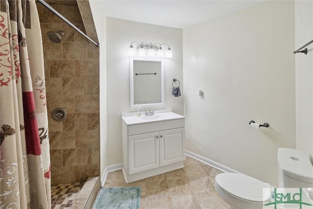 bathroom featuring vanity, toilet, and a shower with shower curtain