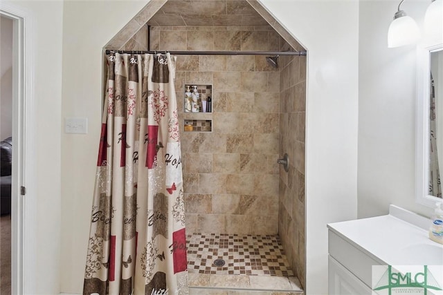 bathroom with vanity and walk in shower