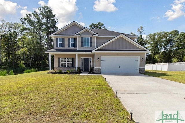 craftsman-style house featuring a garage, a front yard, and covered porch